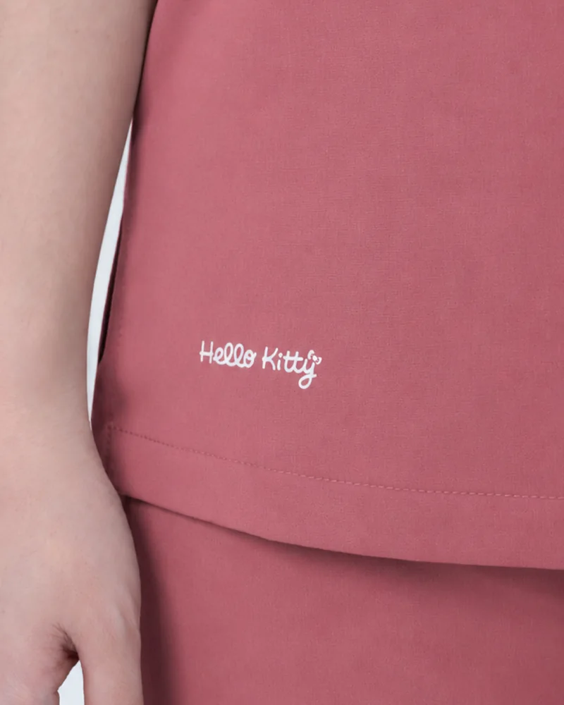 Script embroidery stitched on the chest of a SUB set