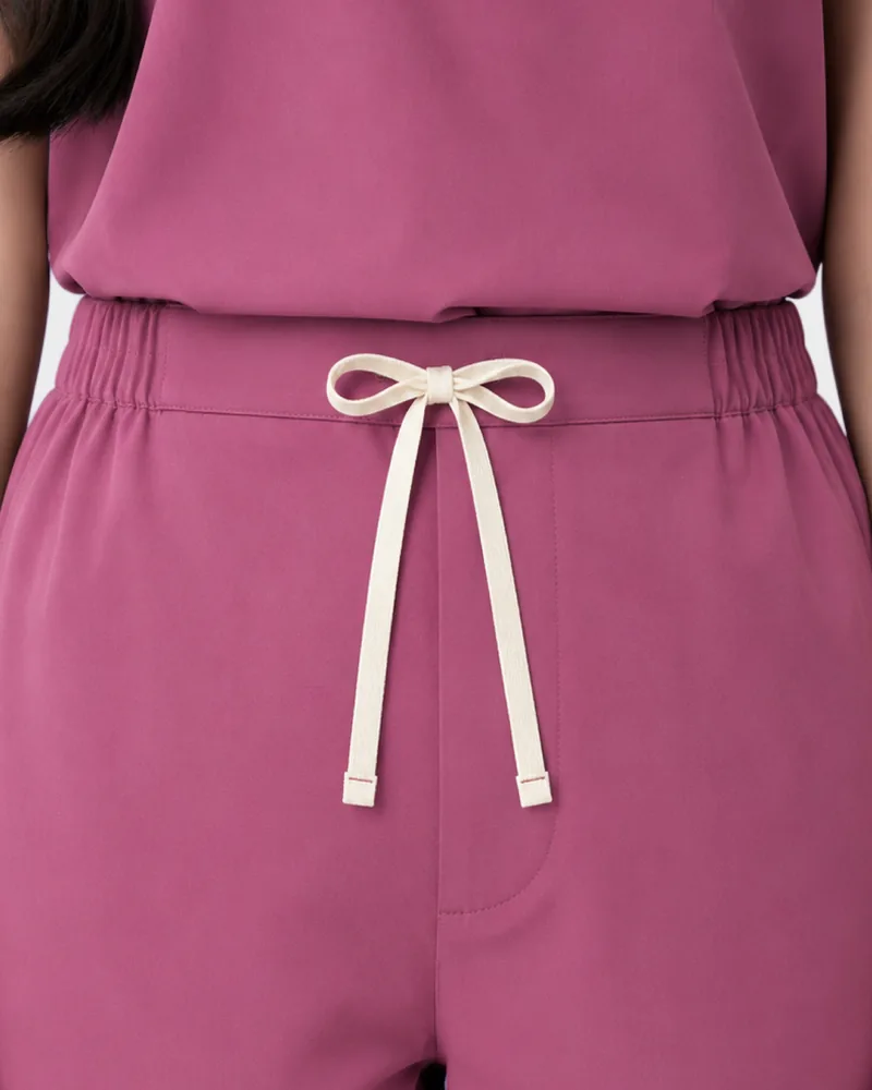 The waist tie on the Kuromi Medical Scrub trousers in Berry Bite